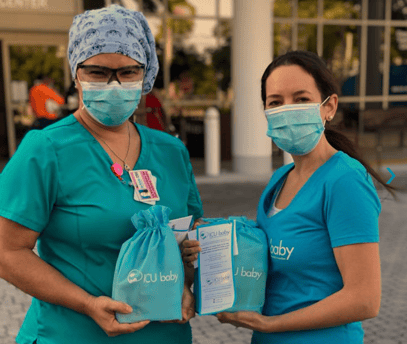 An image of an ICU baby team member and a healthcare worker